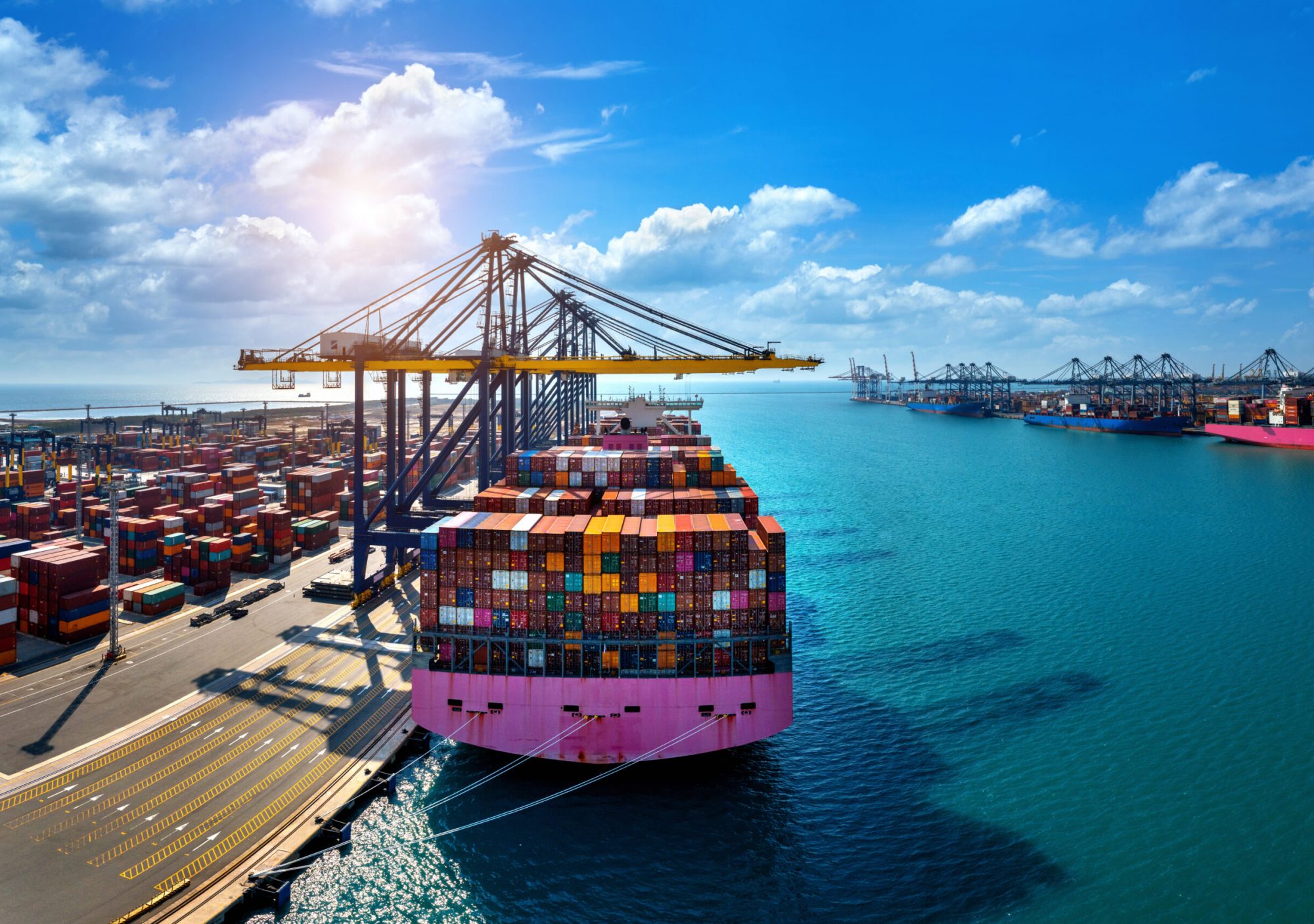 Aerial view of cargo ship and cargo container in harbor. Aerial view of cargo ship and cargo container in harbor.